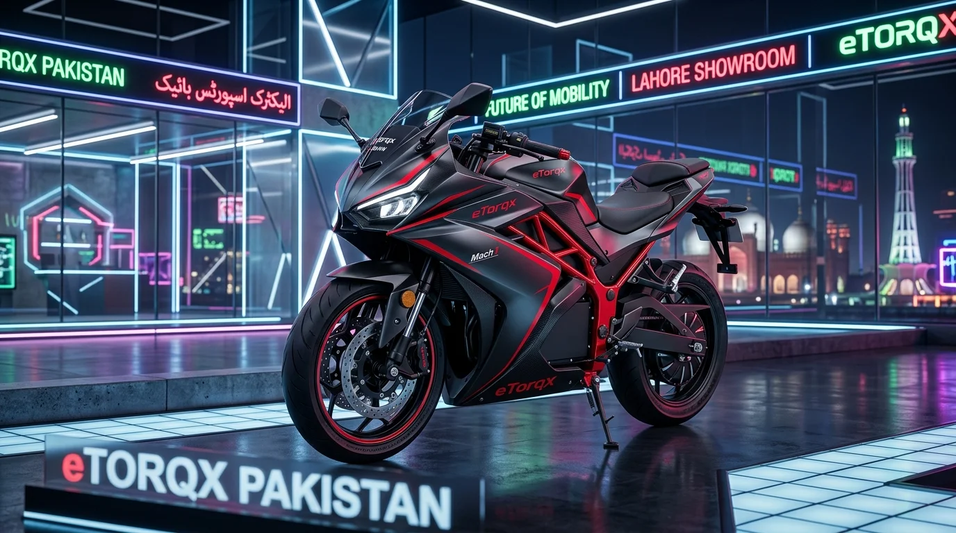 eTorqx Mach 1 electric sports motorcycle in matte black and crimson trellis frame parked in showroom